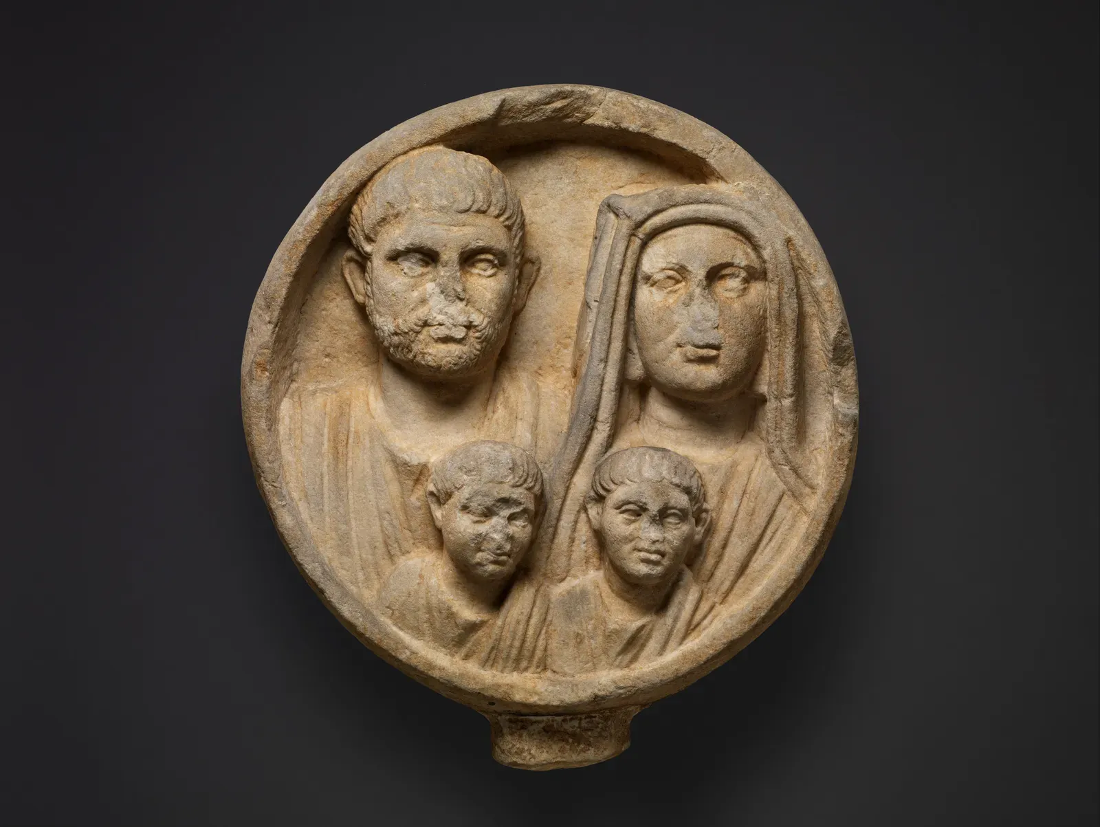 roman funerary relief in a tondo with the group portrait of a family