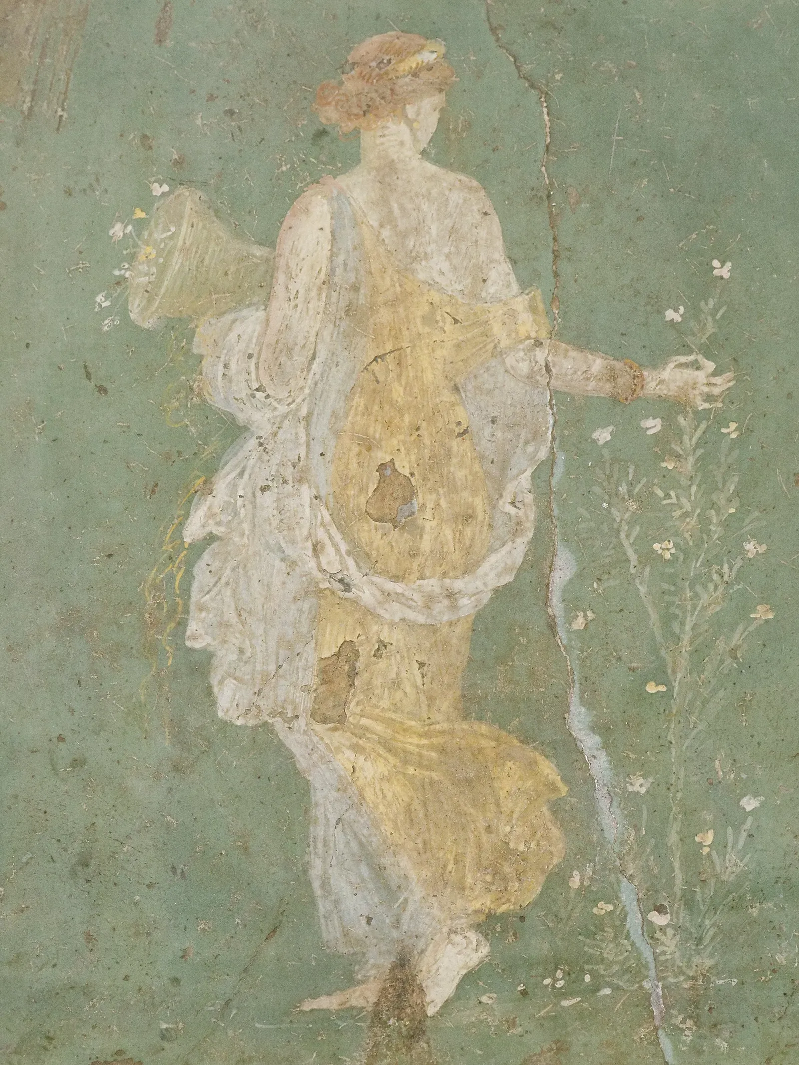 roman fresco of flora, goddess of flowers, gathering petals