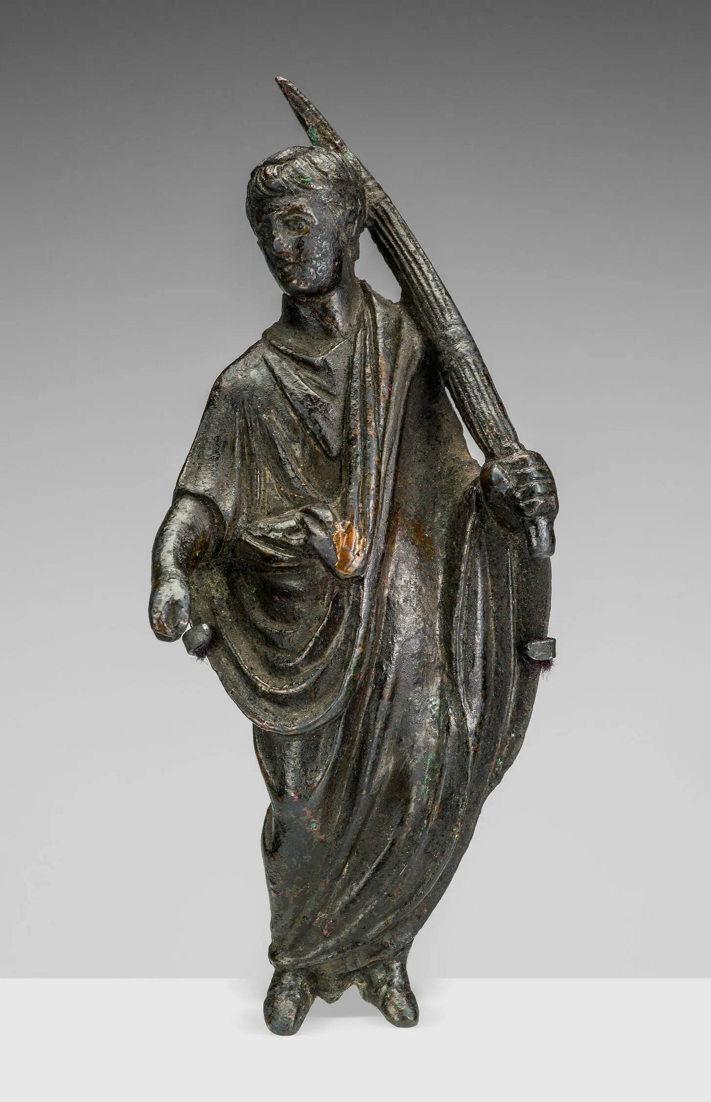 bronze statuette of a roman lictor bearing the fasces, symbol of consular power