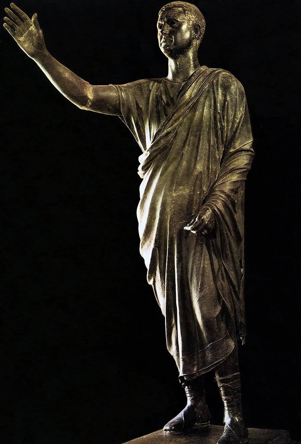 bronze statue of a togate roman citizen in the gesture of an orator