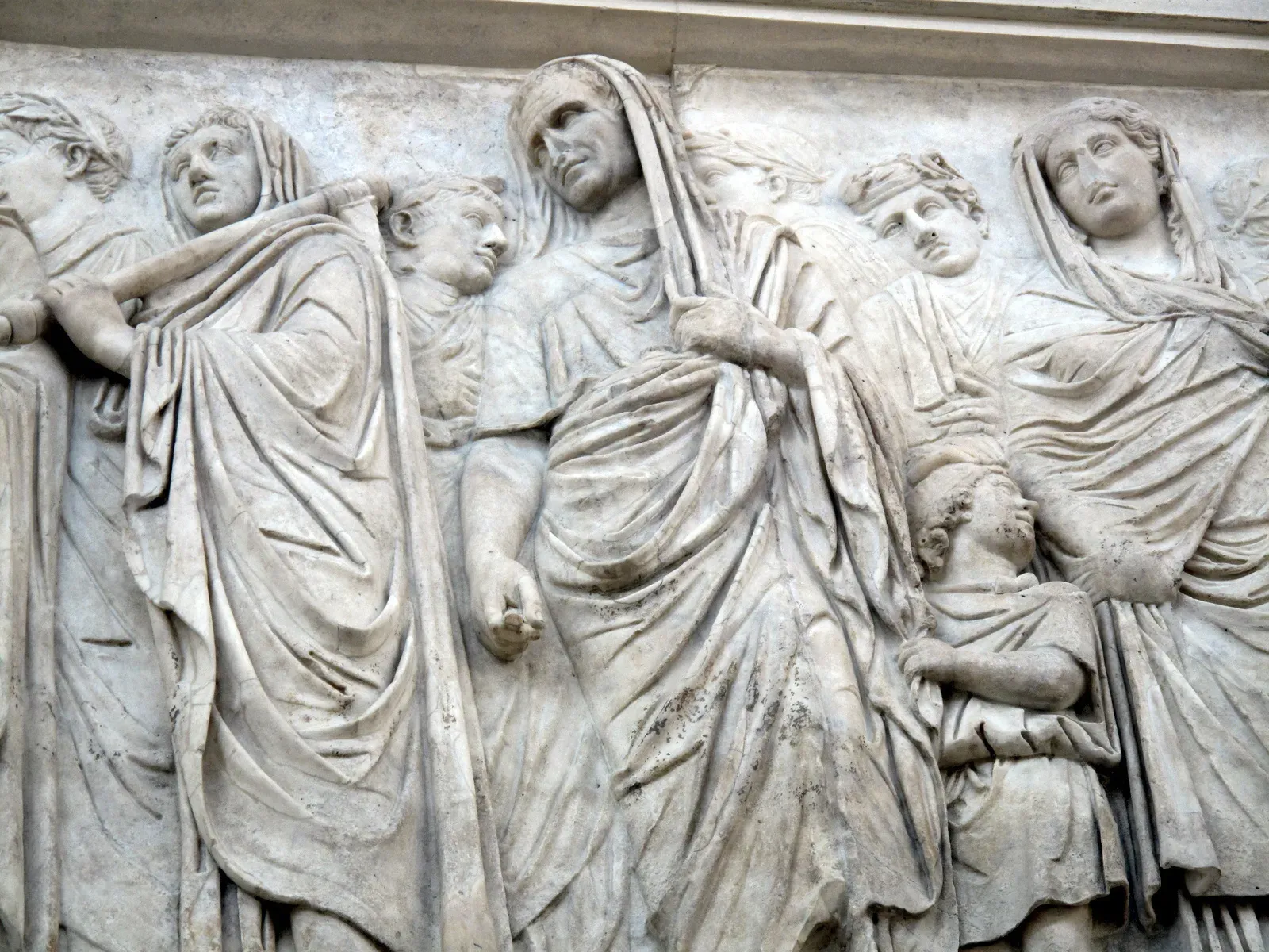 marble relief of the ara pacis with a procession of togate figures of the imperial family
