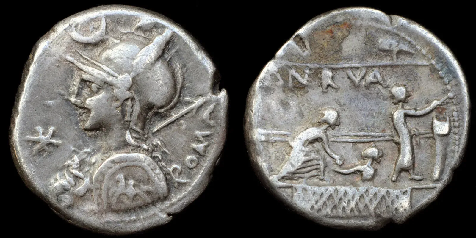 reverse of a roman denarius with two citizens casting their vote in the comitium