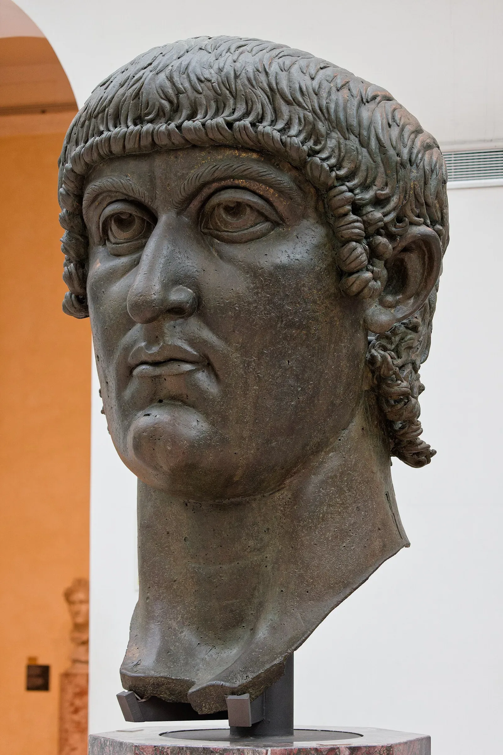 colossal bronze head of the emperor constantine with large eyes staring forward