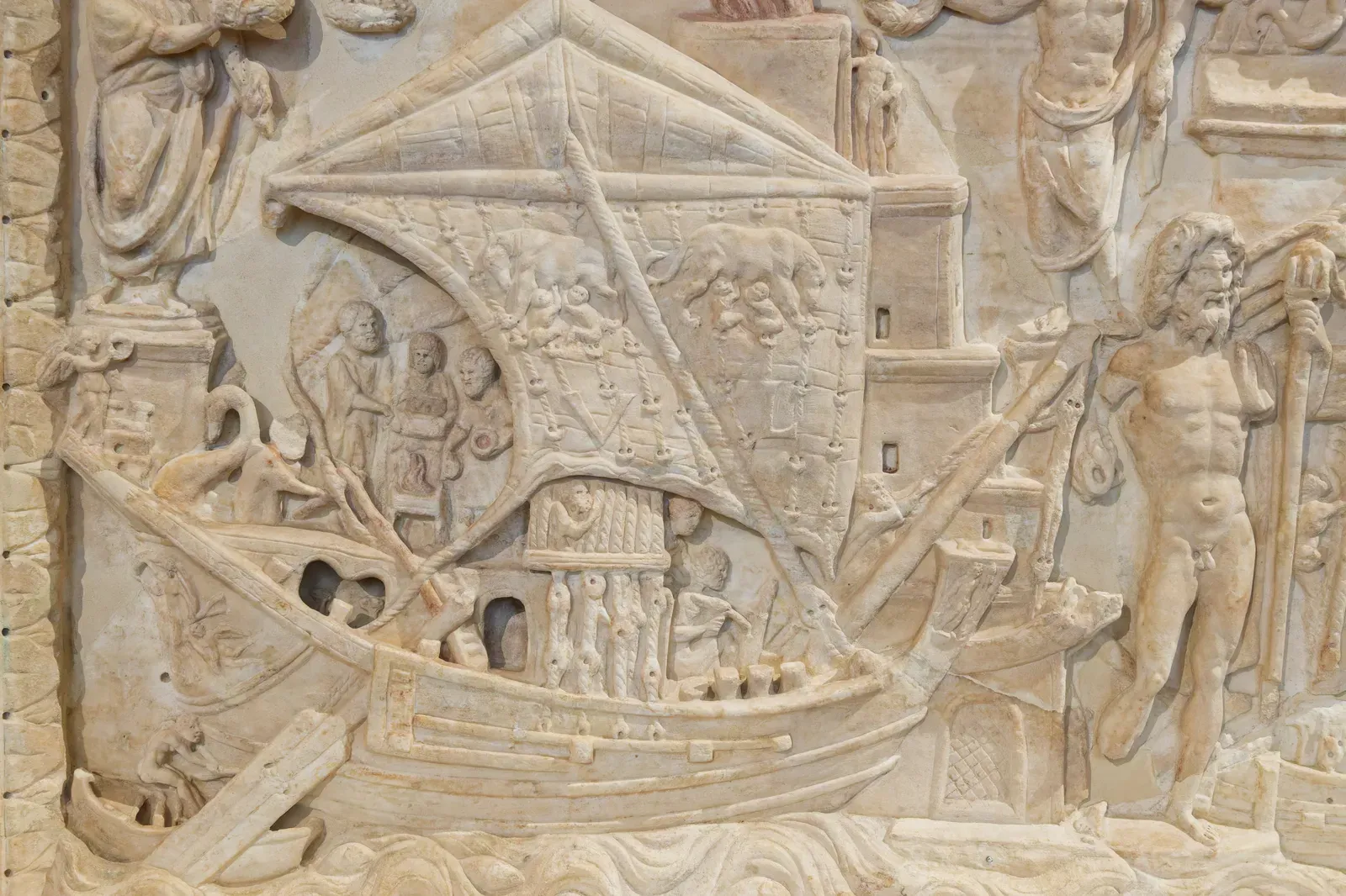 roman relief of the port of portus showing merchant ships, the lighthouse and the bustle of a great commercial harbour