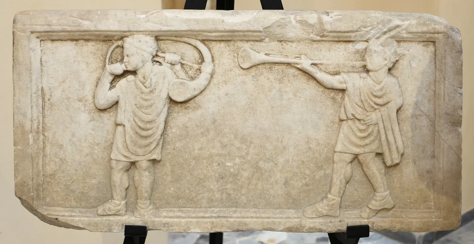 roman relief of soldiers playing the war tuba and cornu