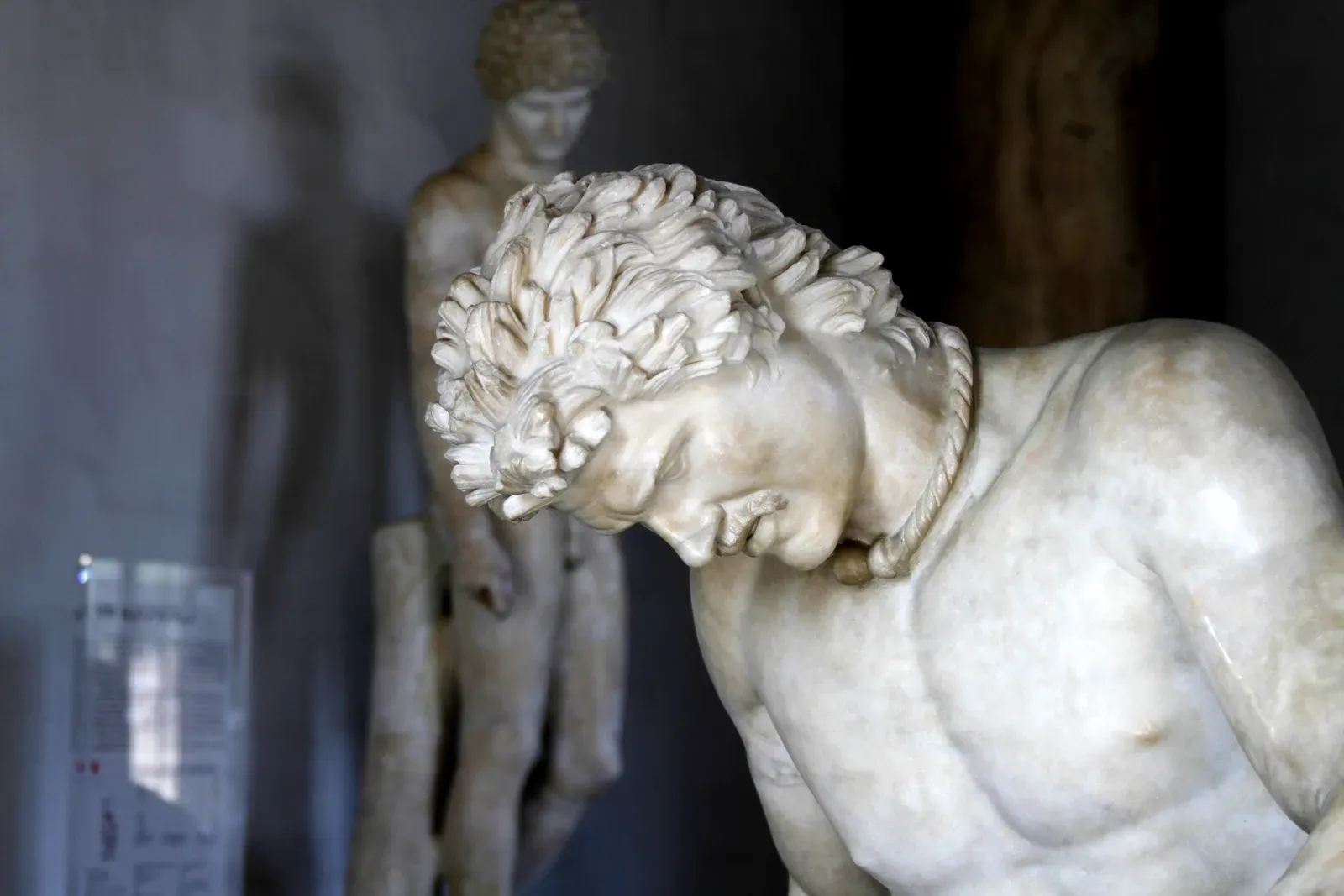 roman marble sculpture of a mortally wounded gaulish warrior collapsing onto his shield