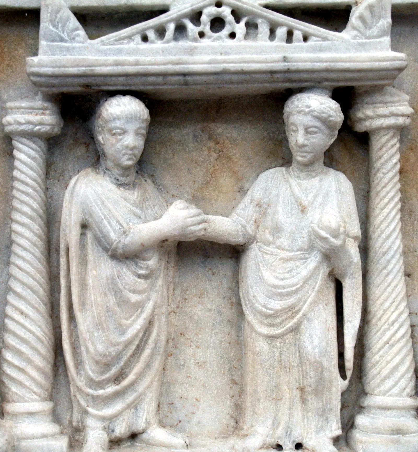 roman funerary relief showing the dextrarum iunctio, the handshake that sealed marriage